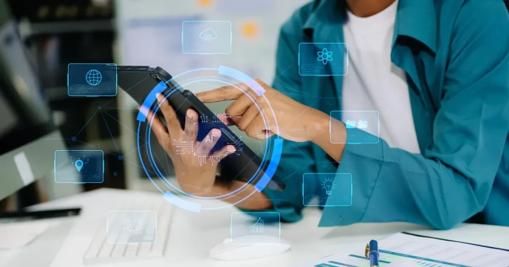 タブレットを操作する人物と浮かび上がる未来的なデジタルインターフェース 就職面接にAIを導入する理由を解説するセクションのイメージ画像