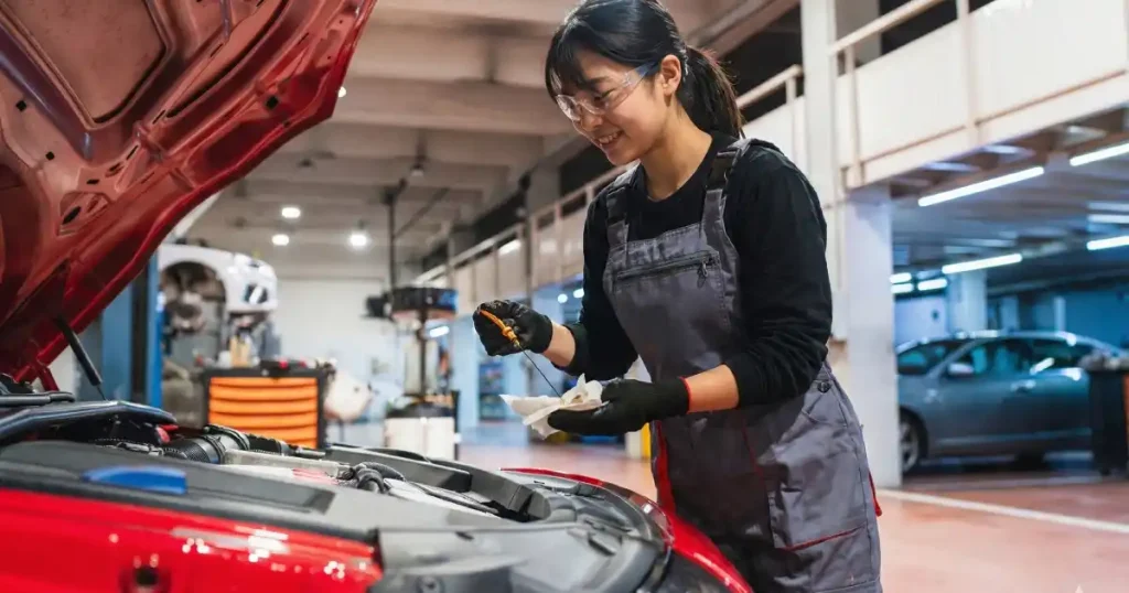 女性自動車整備士が働きやすい職場を見極めるための7つのポイントを説明しているセクションのイラスト。女性整備士、職場環境、キャリアパスに関するガイド。