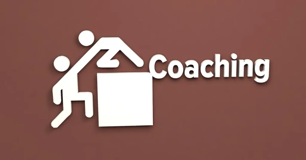 「Coaching」の文字と、人が他者を助けて引き上げるイラスト。キャリアコーチングを活用して転職活動を成功させるためのポイントを解説するセクションに関連。